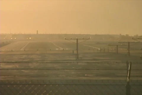 Steady Shot of the Back of a Plane Landing at an Airport Stock Footage 160179