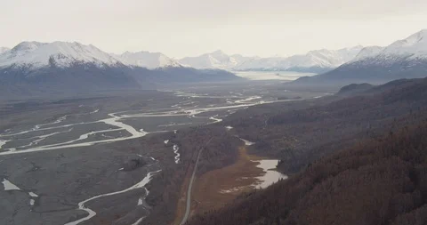 Steady shot behind biplane flying above Alaskan landscape, drone Stock-Footage 107798313