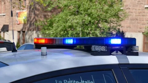 Steady shot of blue and red lights on the top of a police car Stock Footage 90362372