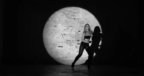 Steady Shot of a Graceful Dancer Dancing On a Black and White Video Stock Footage 158851055