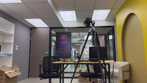 Steady shot inside photography studio with camera on tripod, screen display Stock Footage 255830888