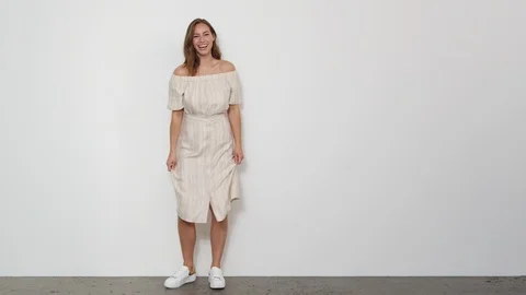Steady Shot of a Model in Button Down Dress Hopping to the Center to Pose 스톡 동영상 116914319