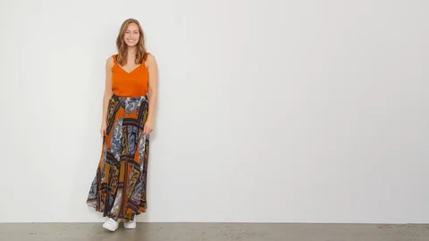 Steady Shot of a Model Entering and then Posing with Her Hair and Skirt 스톡 동영상 116891017