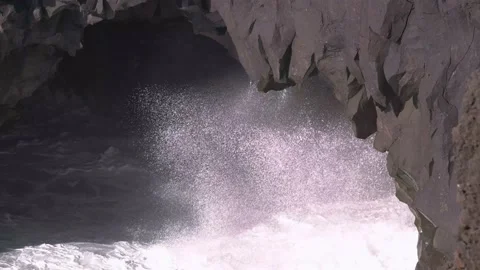 Steady shot of waves hitting sea cave. Lanzarote 4k Video stock 154553370
