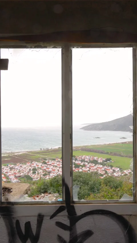 Steady Vertical View of Karaburun Through Broken Window - January 25, 2026 Stock Footage 328246766
