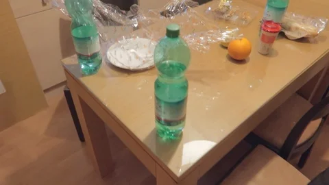 A steady view of an empty dinning table and chairs in a hotel having water Stock Footage 123883641