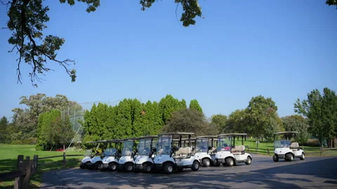 The steady wide view of Golf carts parked in the designated area at the golf Stock Footage 302778369