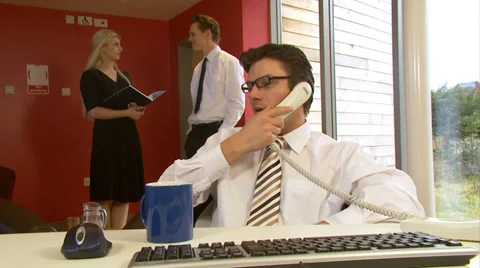 Steadycam motion tracks with tired businessman who takes a break for a sip of Stock-Footage 32717841