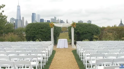 Steadycam Walkthrough of Wedding Ceremony Setup with the New York City Skyline Video stock 89349913