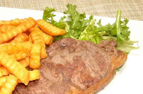Steak And Chips With Lettuce Stock Photos