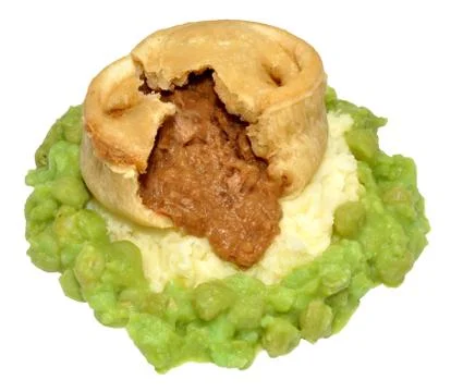Steak And Kidney Pudding With Mashed Potato And Peas Stock Photos