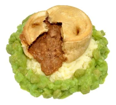 Steak And Kidney Pudding With Mashed Potato And Peas Stock Photos