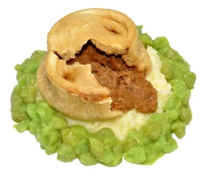 Steak And Kidney Pudding With Mashed Potato And Peas Stock Photos