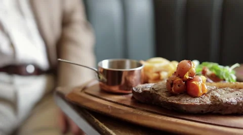 Steak and Tomato Dish Stock Footage 68978954