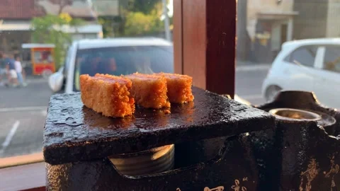 A steak being cooked over a stone in a oriental style restaurant  Video stock 237512530