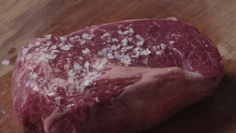 Steak being salted 2 Stock Footage 194748237