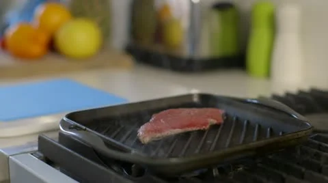 Steak being turned in pan Stock Footage 22040840