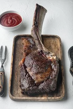 Steak on the bone. tomahawk steak freshly grilled dry aged BBQ food, on woode Foto stock
