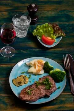 Steak with broccoli Stock Photos