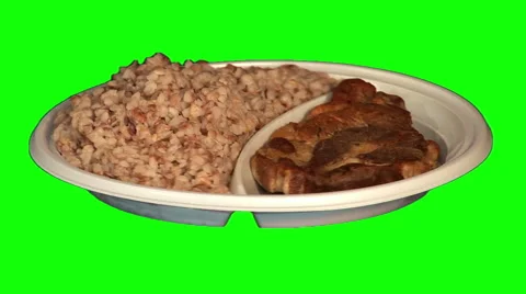Steak with buckwheat on throwaway plate Stock Footage 47560381