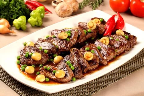 Steak with champignon Stock Photos