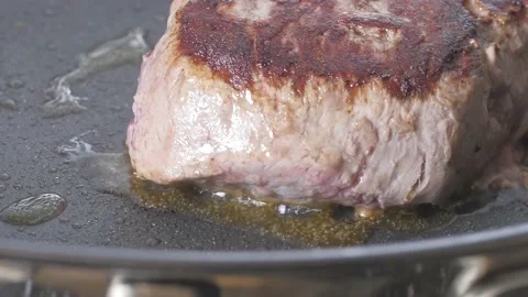 Steak close up in Frying Pan Stock Footage 169612339