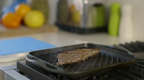 Steak comes out of pan Stock Footage 22040905