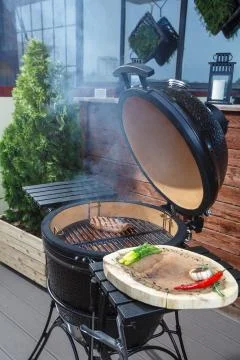 Steak is cooked on the grill Stock Photos