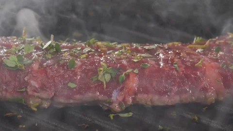 Steak is cooked in a hot grill Stock Footage 113455673