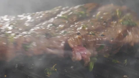 Steak is cooked in a hot grill Stock Footage 113455770