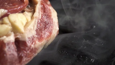 Steak is cooked in a hot grill pan, cooking in slow motion 스톡 동영상 105122085