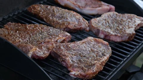 Steak cooking on BBQ grill - Barbecue Stock Footage 68655860