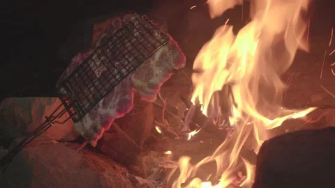 Steak cooking on fire 스톡 동영상 166706524