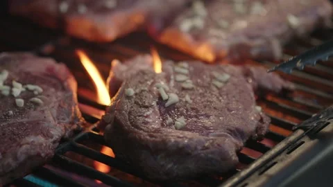 Steak cooking on grill Stock-Footage 155082274