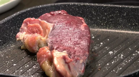 Steak cooking on the grill pan Stock Footage 61353400