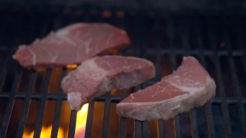 Steak Cooking on a Grill Top Stock Footage 97937816