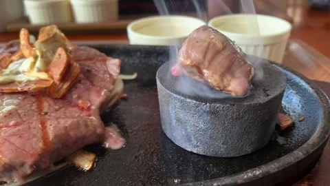 Steak Cooking on Hot Stone. Stock Footage 267168380