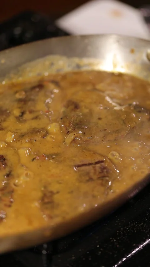 Steak Cooking in Souce Stock Footage 293500772