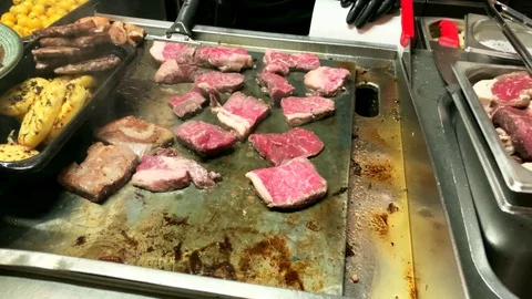 Steak on an electric stove. Stock Footage 128219880