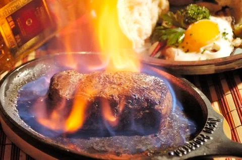 Steak flambe Stock Photos