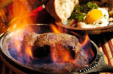 Steak flambe Stock Photos