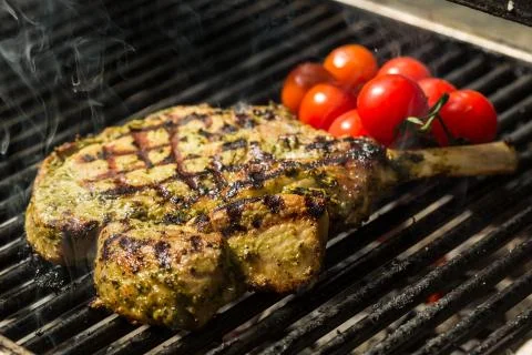 Steak flame broiled on a barbecue Fotos Stock
