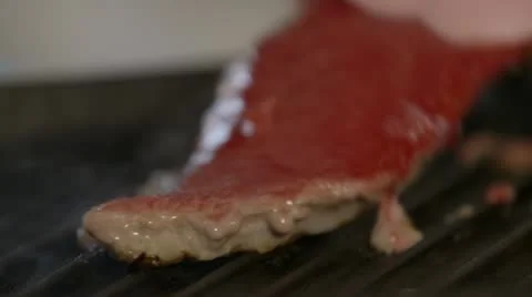 Steak flipped in pan Stock Footage 22069983