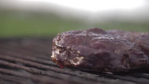 Steak fried on a grill in slow motion Stock Footage 142032136