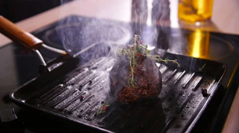 Steak fried in a pan close-up Stock Footage 59083557