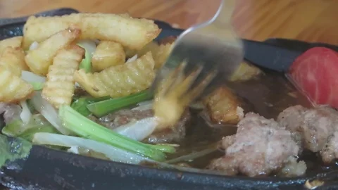 Steak with fried potatoes Stock Footage 70687107