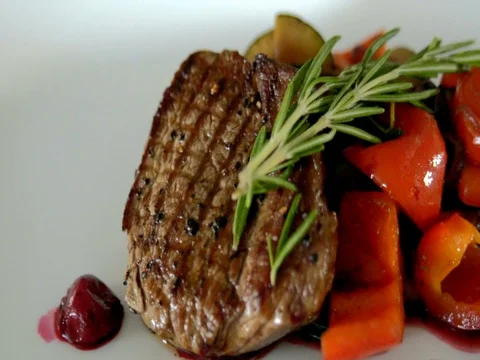 Steak with fried vegetables is on the table. slow motion 스톡 동영상 76056110