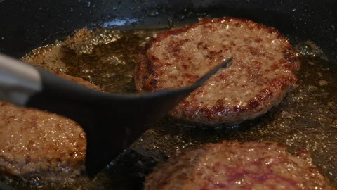 Steak frying in a pan. Beef meat cooking. Food preparation theme. Stock Footage 217470123