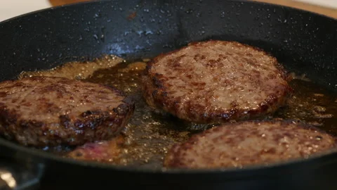 Steak frying in a pan. Beef meat cooking. Food preparation theme. Stock Footage 217481667