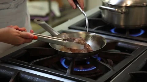 Steak on frying pan Stock Footage 58972568